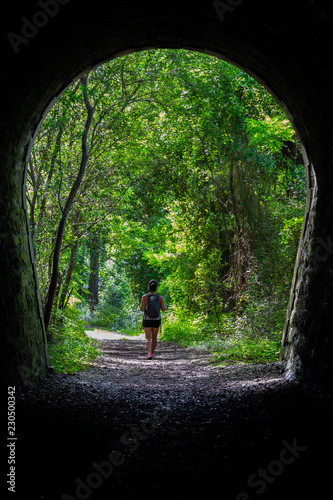 woman is hiking in the woods