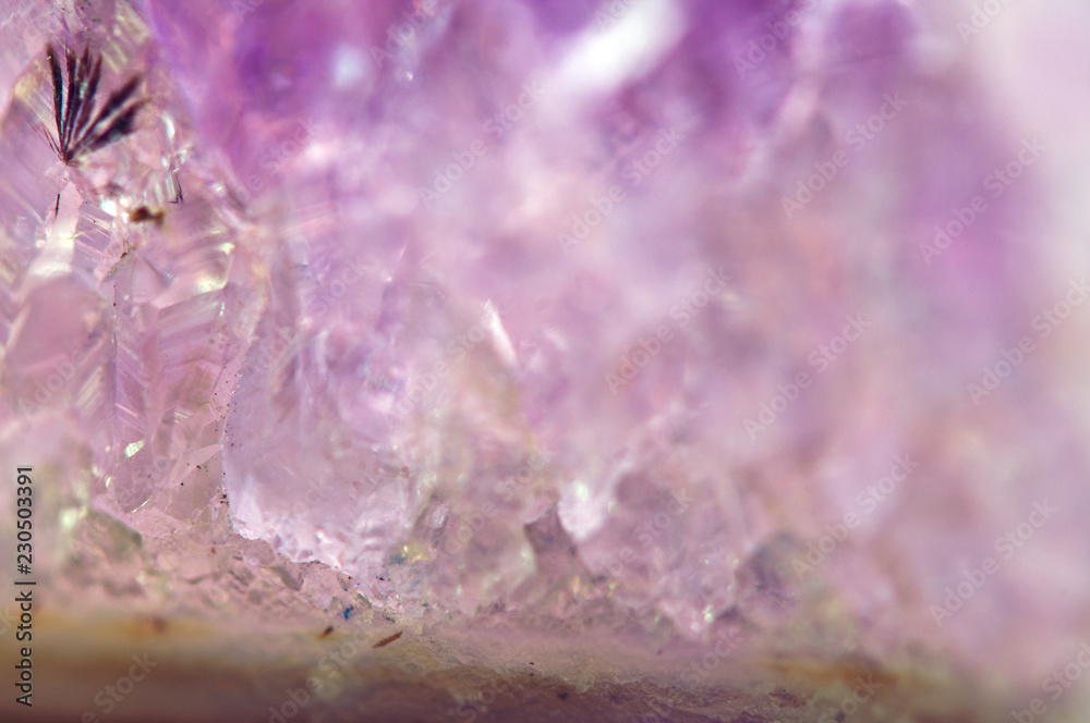 Amethyst natural mineral, beautiful abstract lilac Macro background. Natural light translucent crystal, extreme close-up Amethyst natural mineral, beautiful abstract lilac Macro background. Natural light translucent crystal, extreme close-up