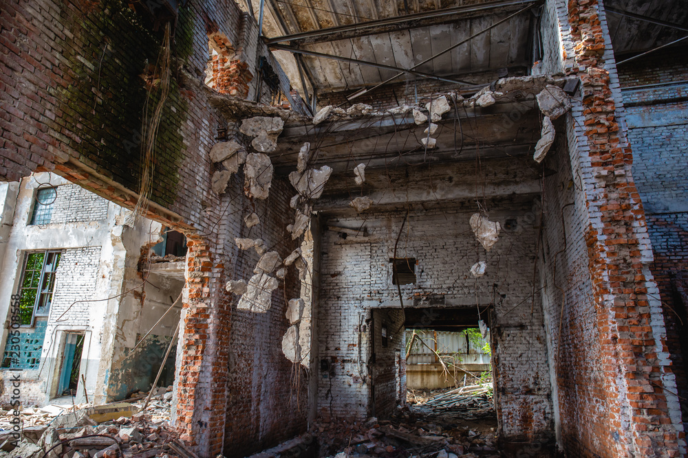 Abandoned and ruined industrial factory building after earthquake disaster or war Abandoned and ruined industrial factory building after earthquake disaster or war