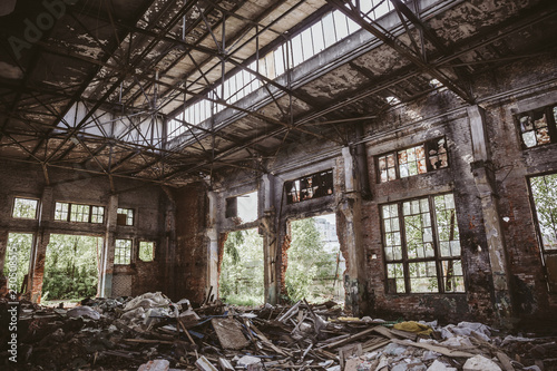 Abandoned and ruined industrial factory building after earthquake disaster or war