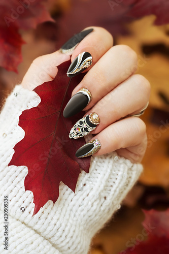 Fashion autumn nail art. Autumn background. Fashion background.