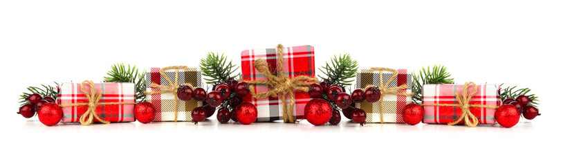 Christmas border of plaid print wrapped gift boxes and decorations isolated on a white background
