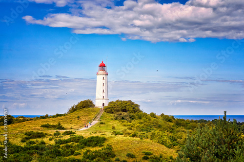 Dornbusch Lighthouse located in the north of the German island of Hiddensee in the Baltic Sea at sunny weather © DR pics