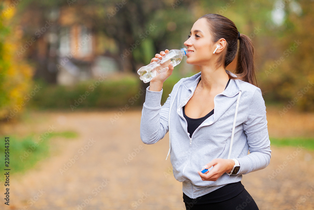 Sport outdoor. Woman Drinking Water After Running Sport outdoor. Woman Drinking Water After Running