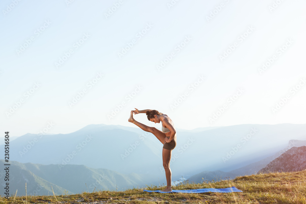 Healthy young woman, balanced, practicing energy yoga
