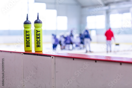 ice hockey rink, bottle on board