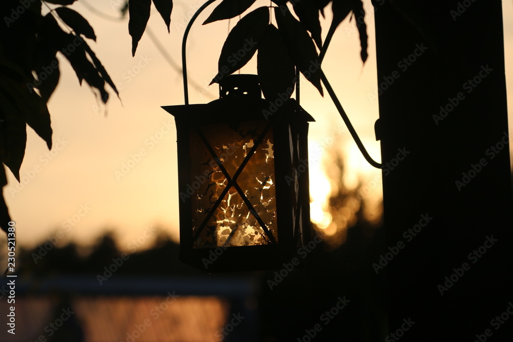 silhouette of lantern in sunset