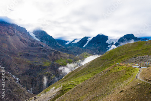 Traditional buddhist prayer flags over foggy mountain background in Annapurna Conservation Area, Nepal