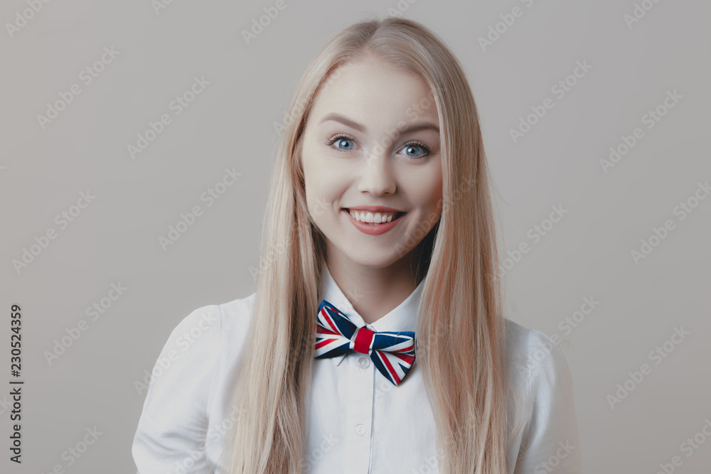 Young playful cute blonde with bow tie is smiling Young playful cute blonde with bow tie is smiling