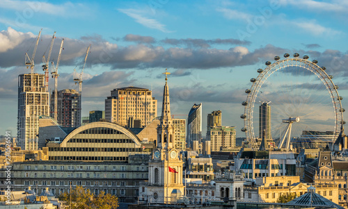 London skyline with London eye at sunny day photo