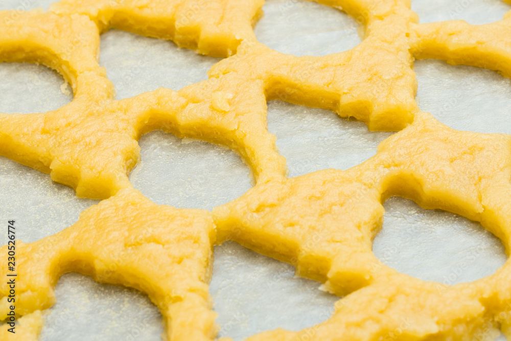 background made of raw dough for christmas cookies for children, making gingerbread in form of ball, fir tree close-up. New year treat. Homemade bakery, xmas sweet, winter holidays concept background made of raw dough for christmas cookies for children, making gingerbread in form of ball, fir tree close-up. New year treat. Homemade bakery, xmas sweet, winter holidays concept