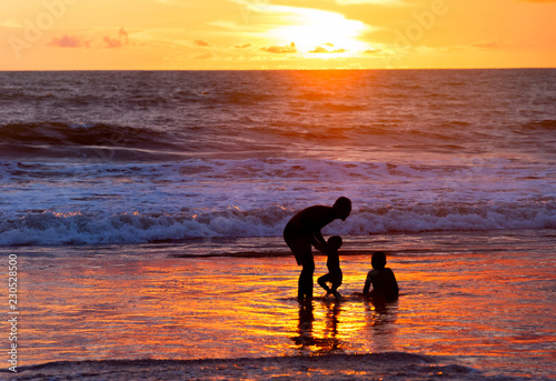 Father with children at beach