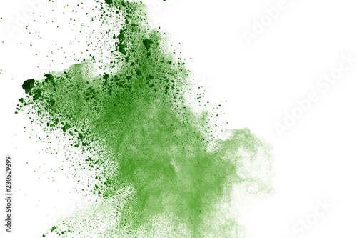 abstract powder splatted background,Freeze motion of green powder exploding/throwing green dust