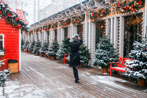 Canvas Print Beautiful russian girl in a cloud day in winter style clothes, walking in Tversk