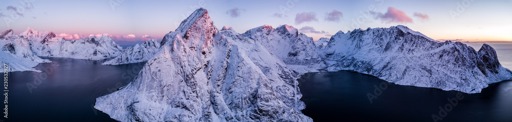 Aerial drone photo - Beautiful sunrise over the mountains of the Lofoten Islands.  Reine, Norway