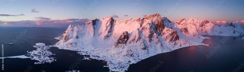 Aerial drone photo - Beautiful sunrise over the mountains of the Lofoten Islands.  Reine, Norway - obrazy, fototapety, plakaty 