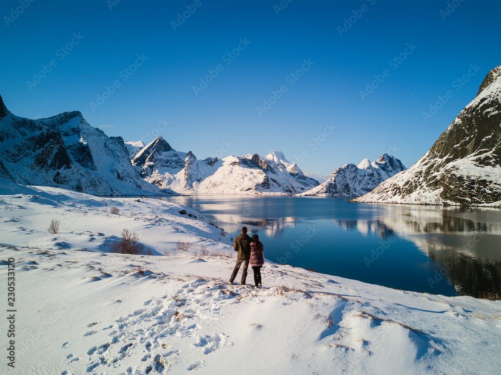 Married couple in the mountains of Reine Norway.  Lofoten Islands