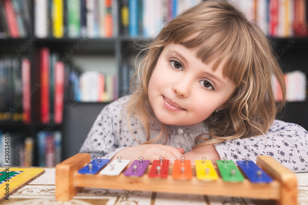 Cute little girl playing colorful cymbals Cute little girl playing colorful cymbals