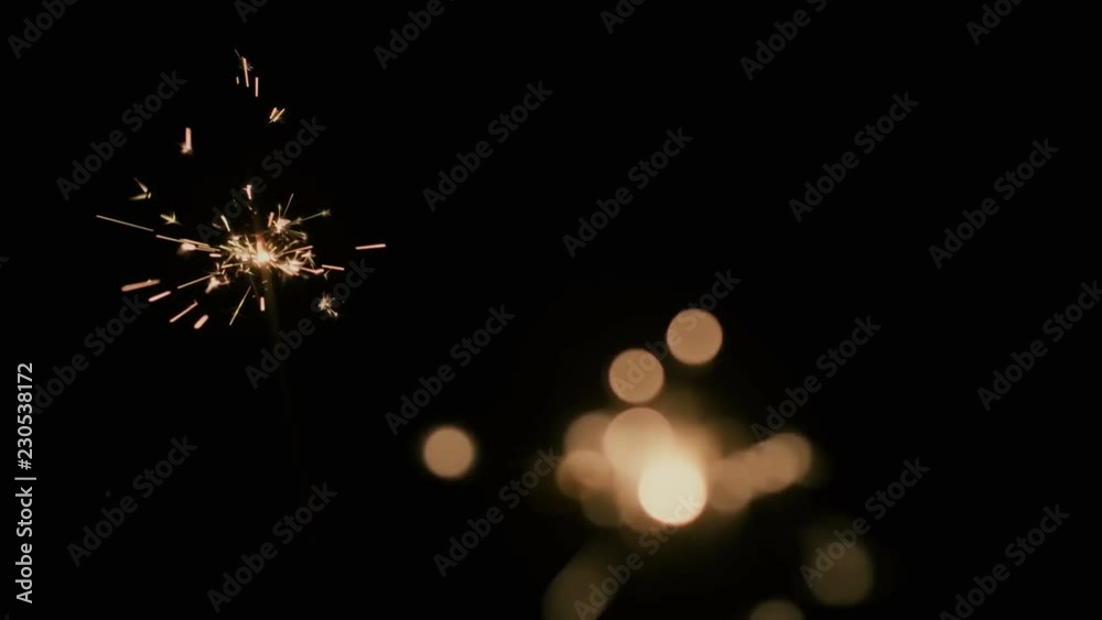 Blurred sparks from fire in front of black backgound.
You can easily key out the background, or use soft light/overlay blending mode for adding to your composition.