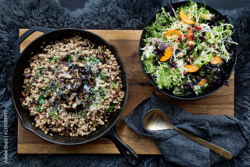 Pan of groats and bowl of salad