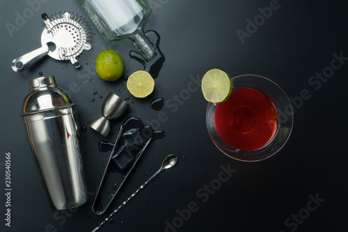 Obraz na plátne Cosmopolitan cocktail and bar equipments, stainless steel cocktail shaker and ji