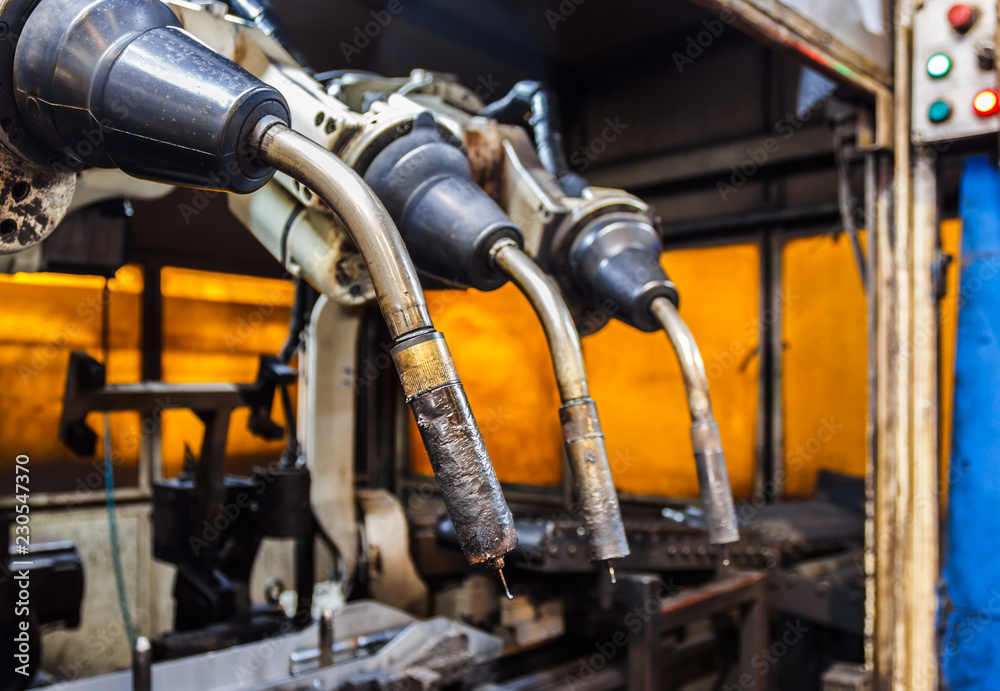 Fototapeta premium Robots welding team in the automotive parts industry