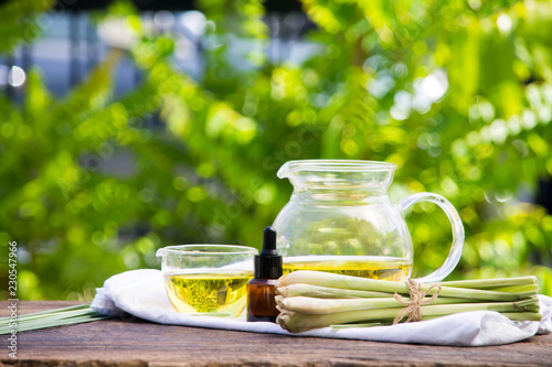 Lemongrass essential oil is placed on the table using a hand-drip oil lemongrass oil - spa and insect repellent.