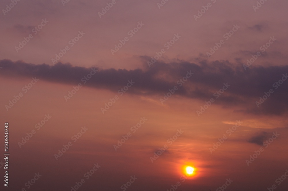 The sunset sky background with sunlight for the dusk moment in the evening. Photo has space for text. The sunset sky background with sunlight for the dusk moment in the evening. Photo has space for text.