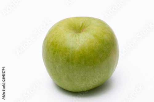Green apple with white background close up