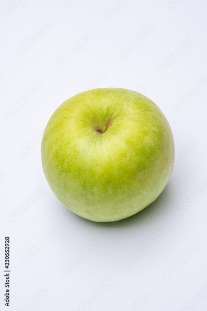 Green apple with white background close up Green apple with white background close up