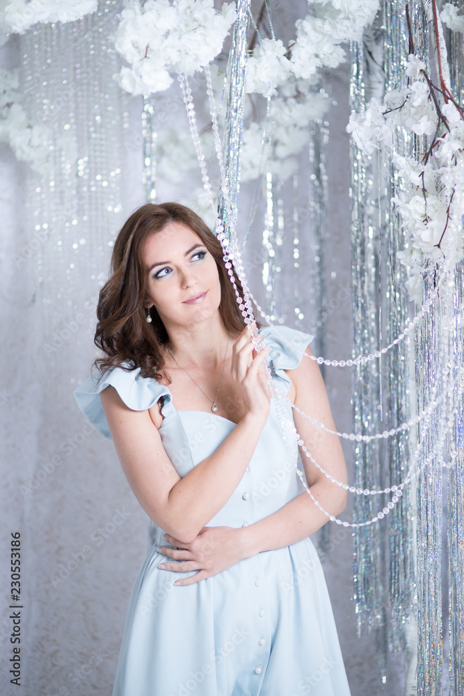 Beautiful young woman in silver studio Beautiful young woman in silver studio