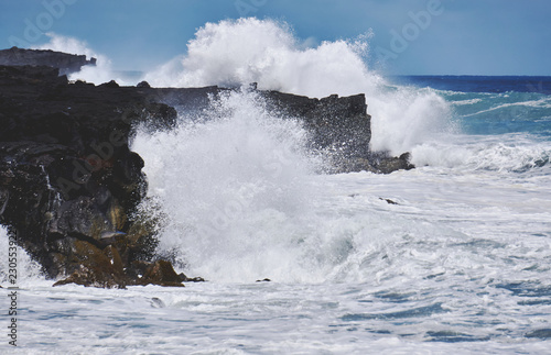 Crashing waves on Lava Rock Cliffs in Hawaii