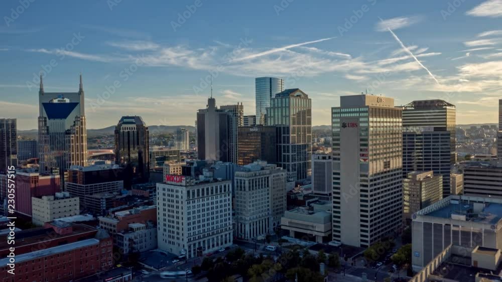 Tennessee Nashville Aerial v3 Cityscape hyperlapse flying low over river and over downtown buildings 10/18