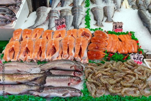 Salmon and prawns for sale at a market in London, UK