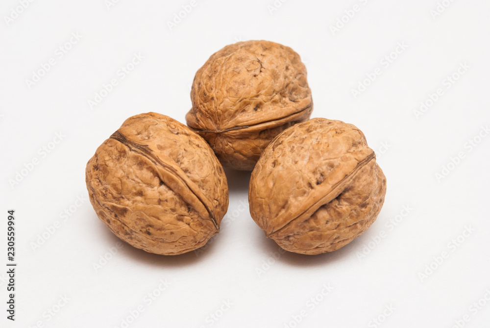 Three walnuts isolated on white background Three walnuts isolated on white background