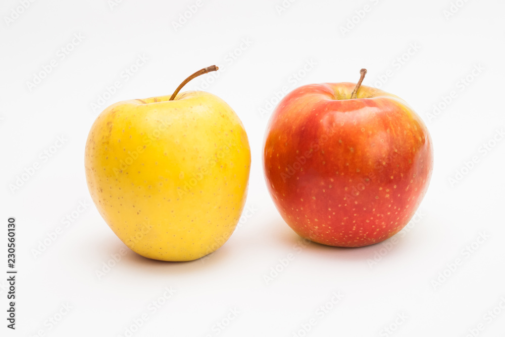 Ripe yellow and red apples isolated on white background