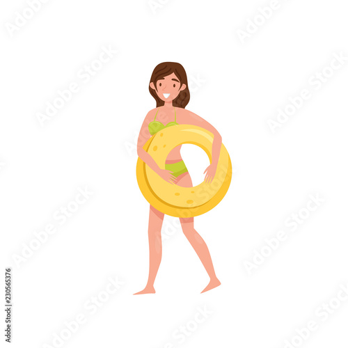 Smiling girl holding yellow inflatable ring in hands. Young woman in green swimming suit. Flat vector design