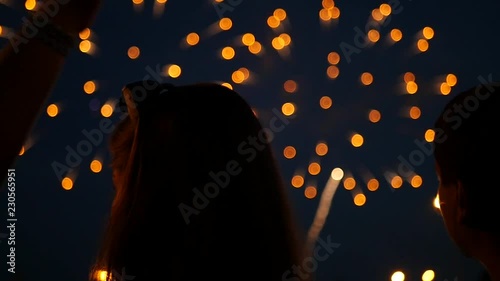 Friends stand and watch the evening fireworks. slow motion, 1920x1080, full hd