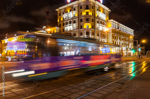 The motion blurred tram in the evening.