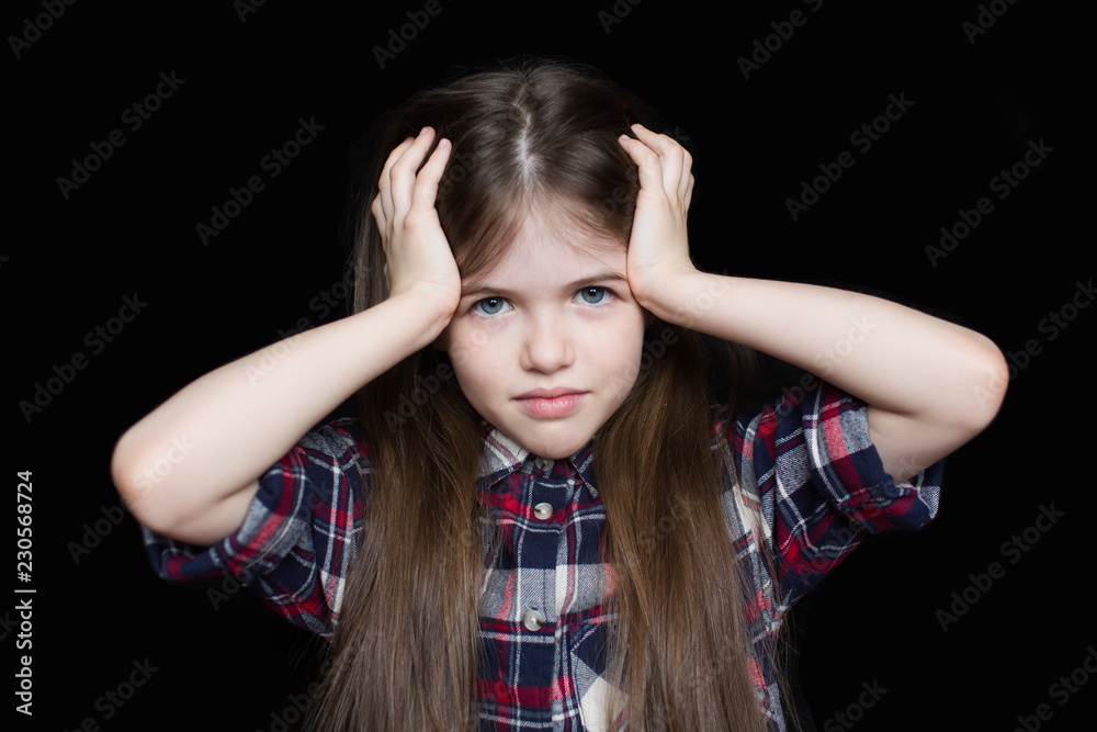 Little sad girl holding her head Little sad girl holding her head