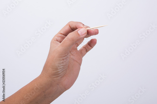 hand Holding Cotton Swab
