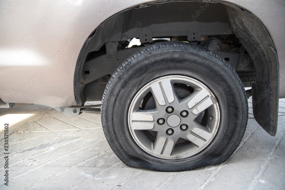abandon car with flat tire and tire burst from accident on the road. abandon car with flat tire and tire burst from accident on the road.