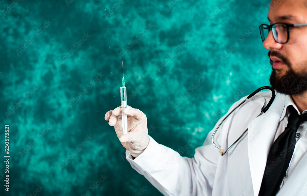 Doctor holding a syringe Doctor holding a syringe