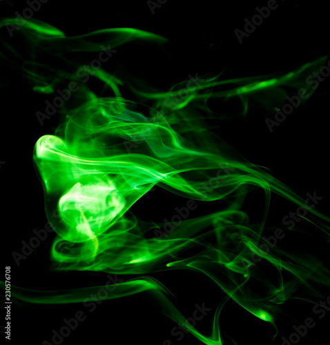 Green smoke on black background