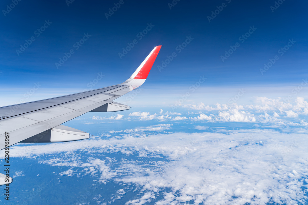 Obraz premium Beautiful view from airplane window and blue sky on nice sunny day, This time in altitude during flight.