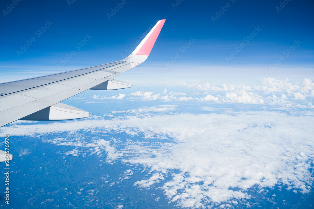 Beautiful view from airplane window and blue sky on nice sunny day, This time in altitude during flight. Beautiful view from airplane window and blue sky on nice sunny day, This time in altitude during flight.