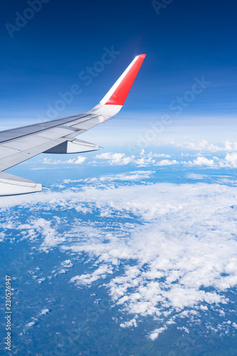 Beautiful view from airplane window and blue sky on nice sunny day  This time in altitude during flight.