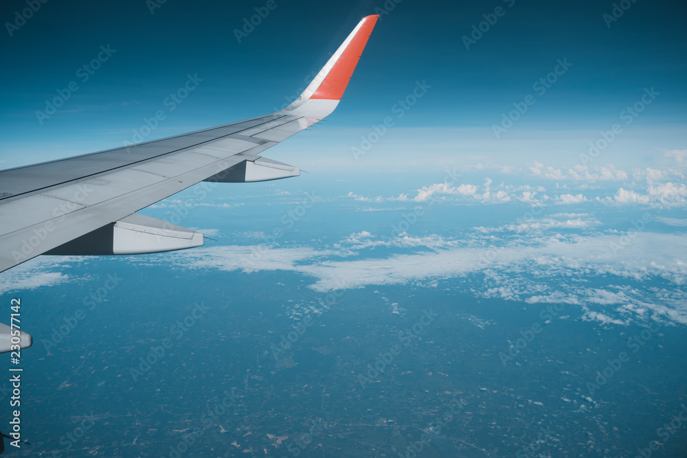 Beautiful view from airplane window and blue sky on nice sunny day, This time in altitude during flight. Beautiful view from airplane window and blue sky on nice sunny day, This time in altitude during flight.