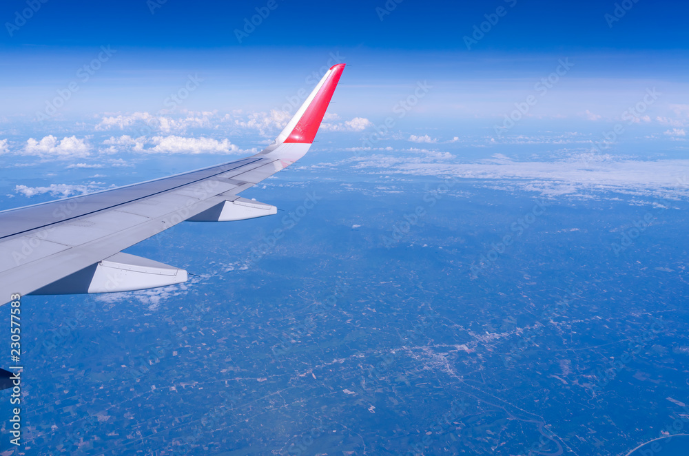 Beautiful view from airplane window and blue sky on nice sunny day, This time in altitude during flight. Beautiful view from airplane window and blue sky on nice sunny day, This time in altitude during flight.