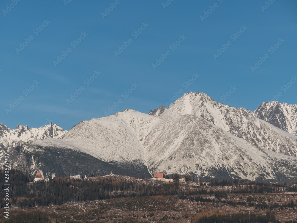Snow mountains. Panorama of High Tatras. Snow mountains and blue sky.